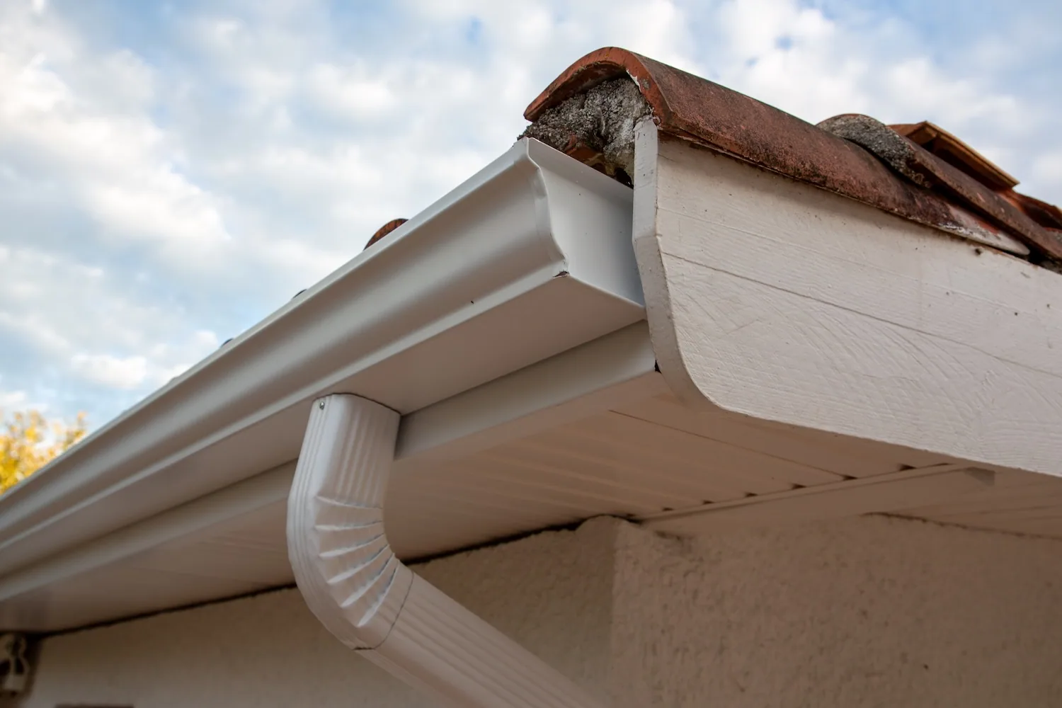 White seamless gutter downspout clay tile roof, Sanford FL